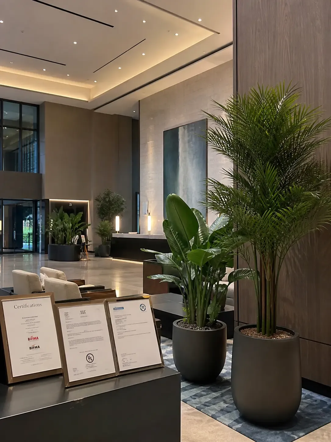 LaySun artificial plants installed in a compliant commercial hotel lobby with certification documentation